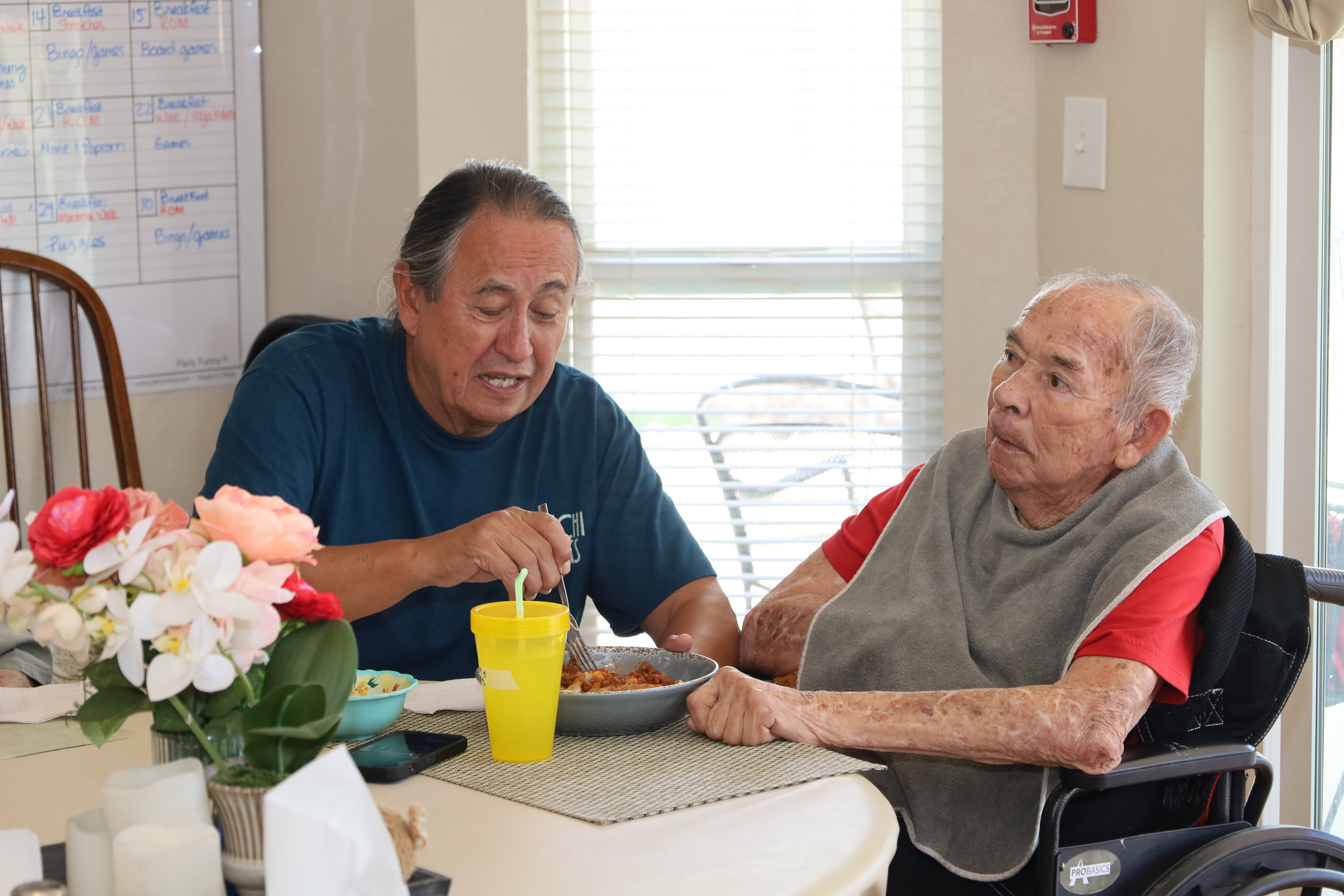 Residents and caregivers sharing an everyday moment at Casita Senior Living