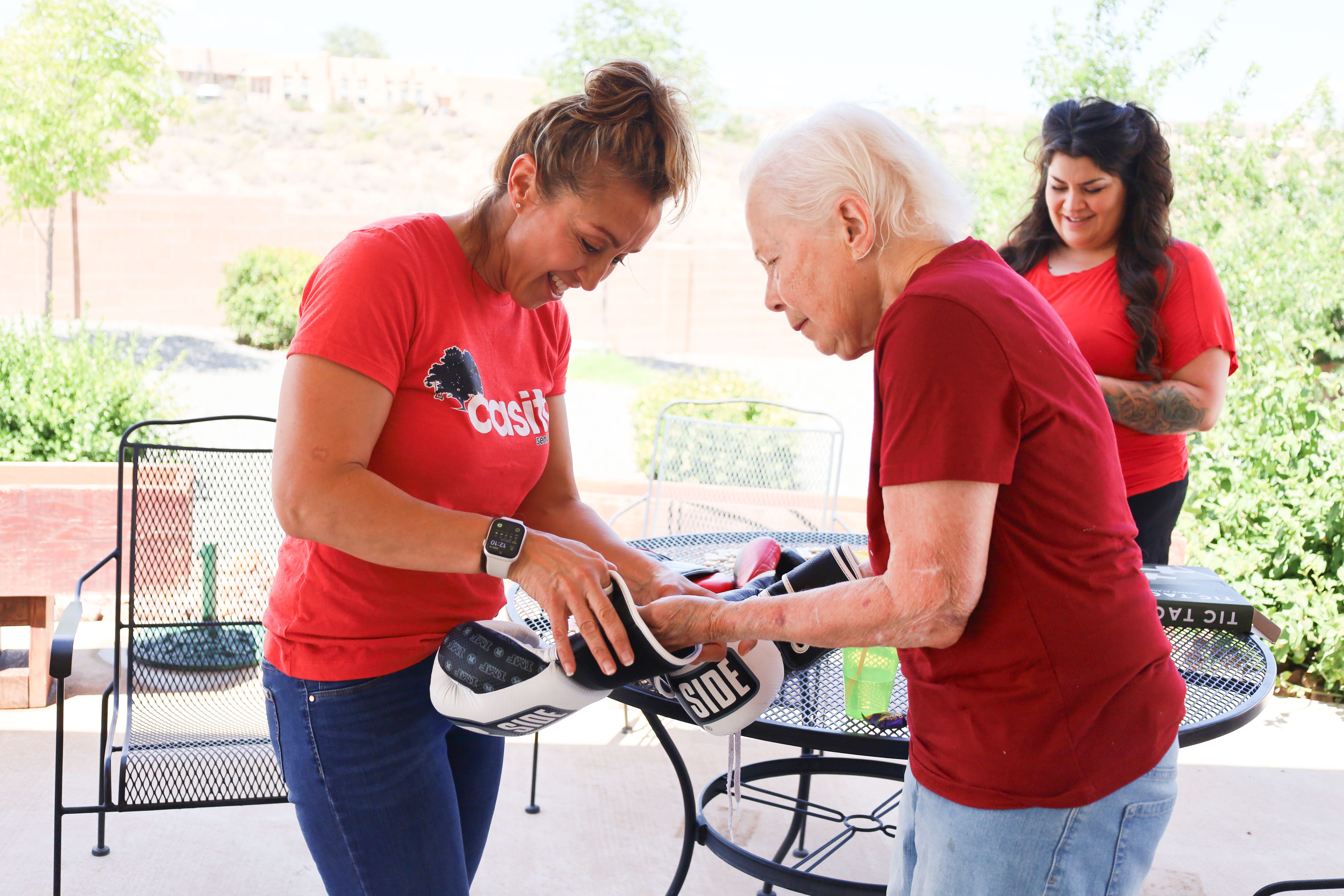 Residents and caregivers sharing an everyday moment at Casita Senior Living