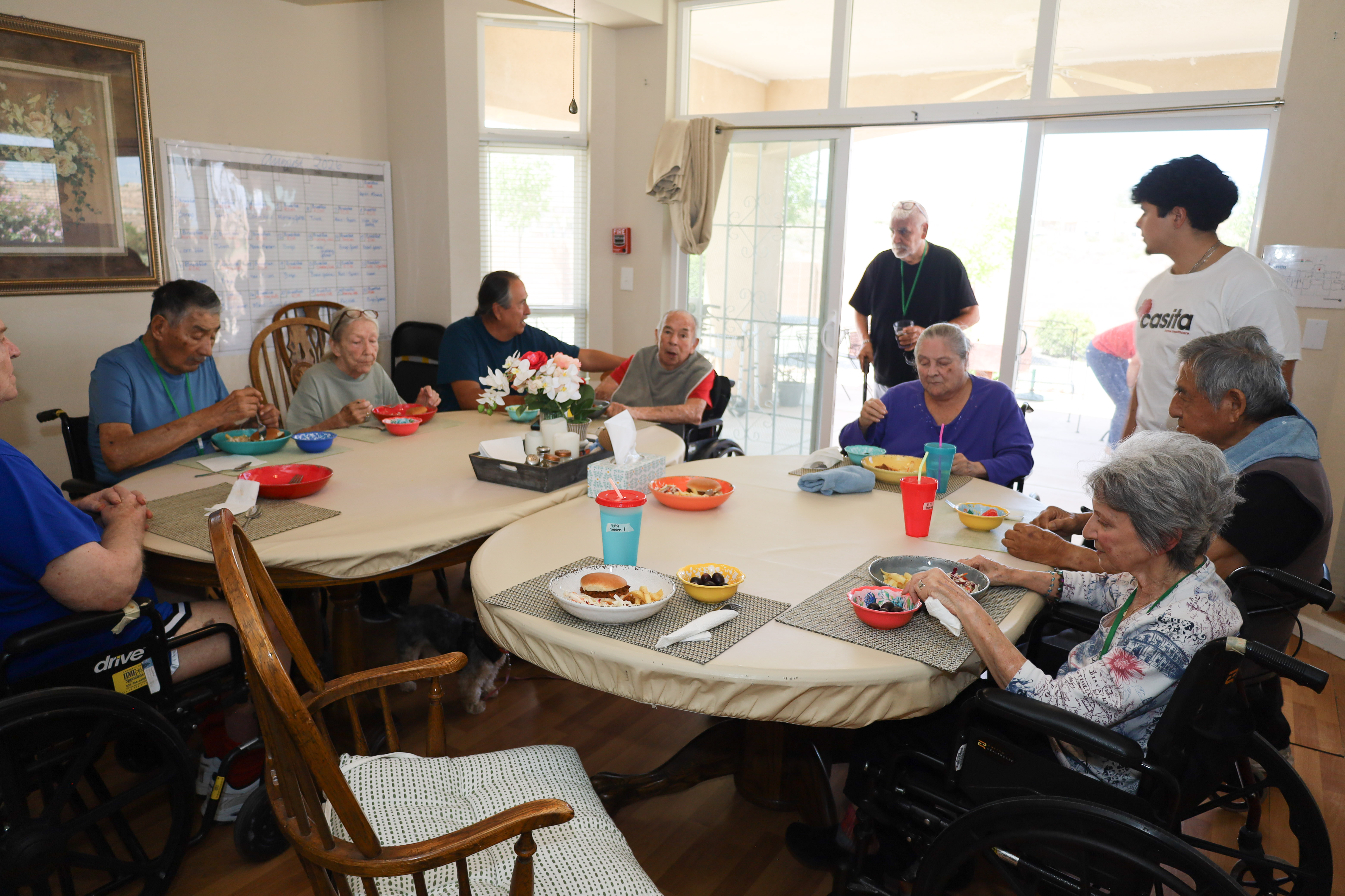 Residents and caregivers sharing an everyday moment at Casita Senior Living
