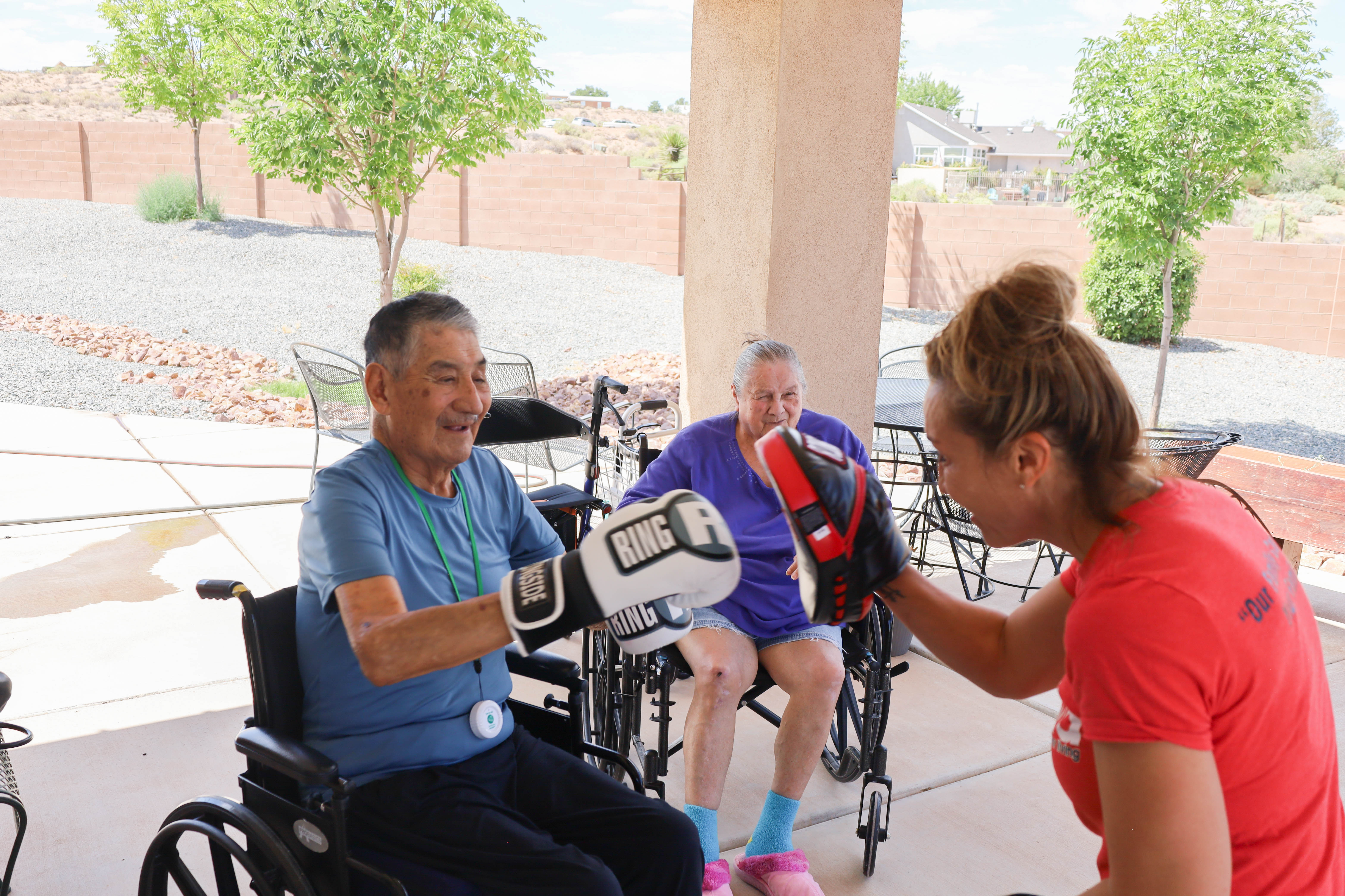 Residents and caregivers sharing an everyday moment at Casita Senior Living