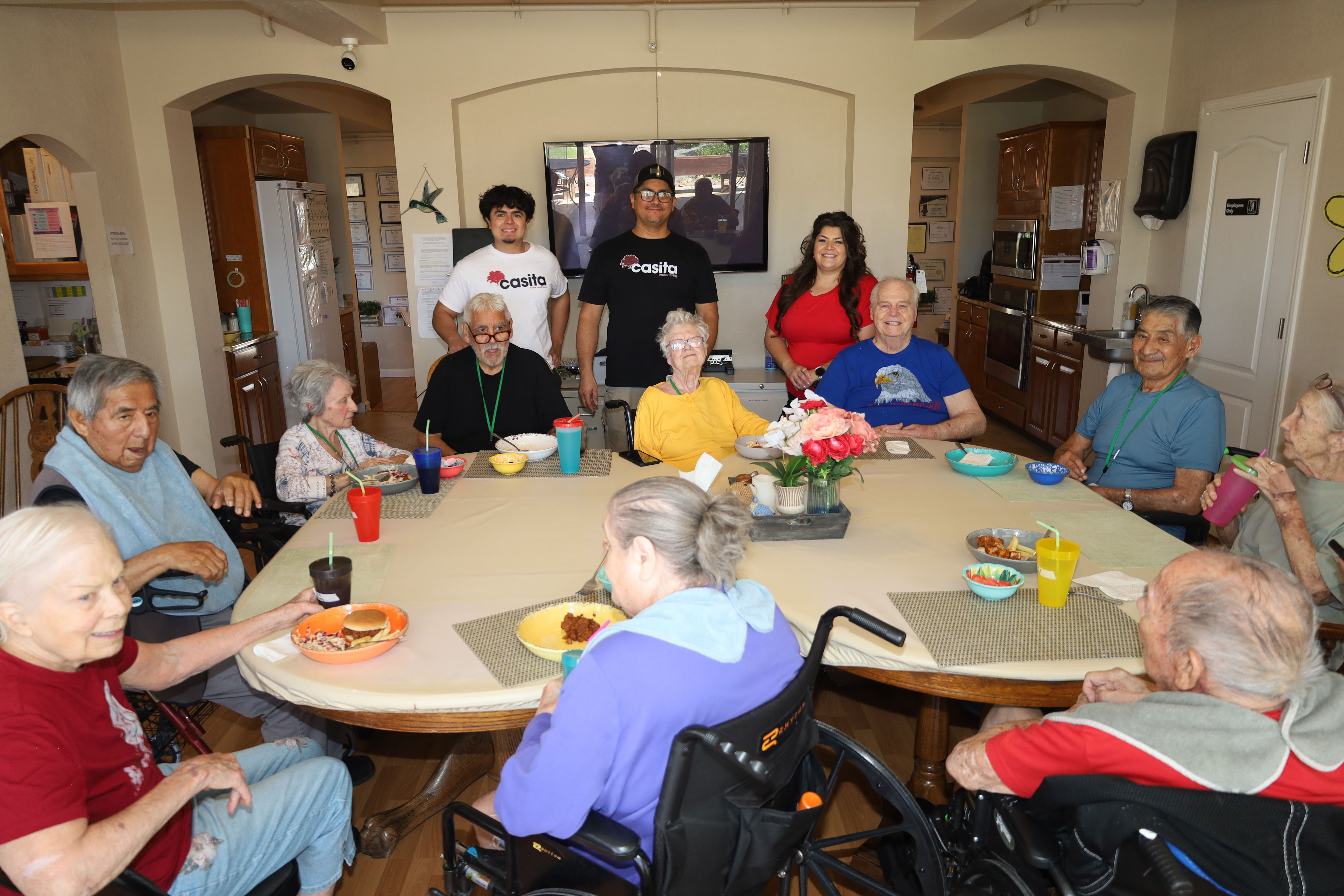 Residents and caregivers sharing an everyday moment at Casita Senior Living
