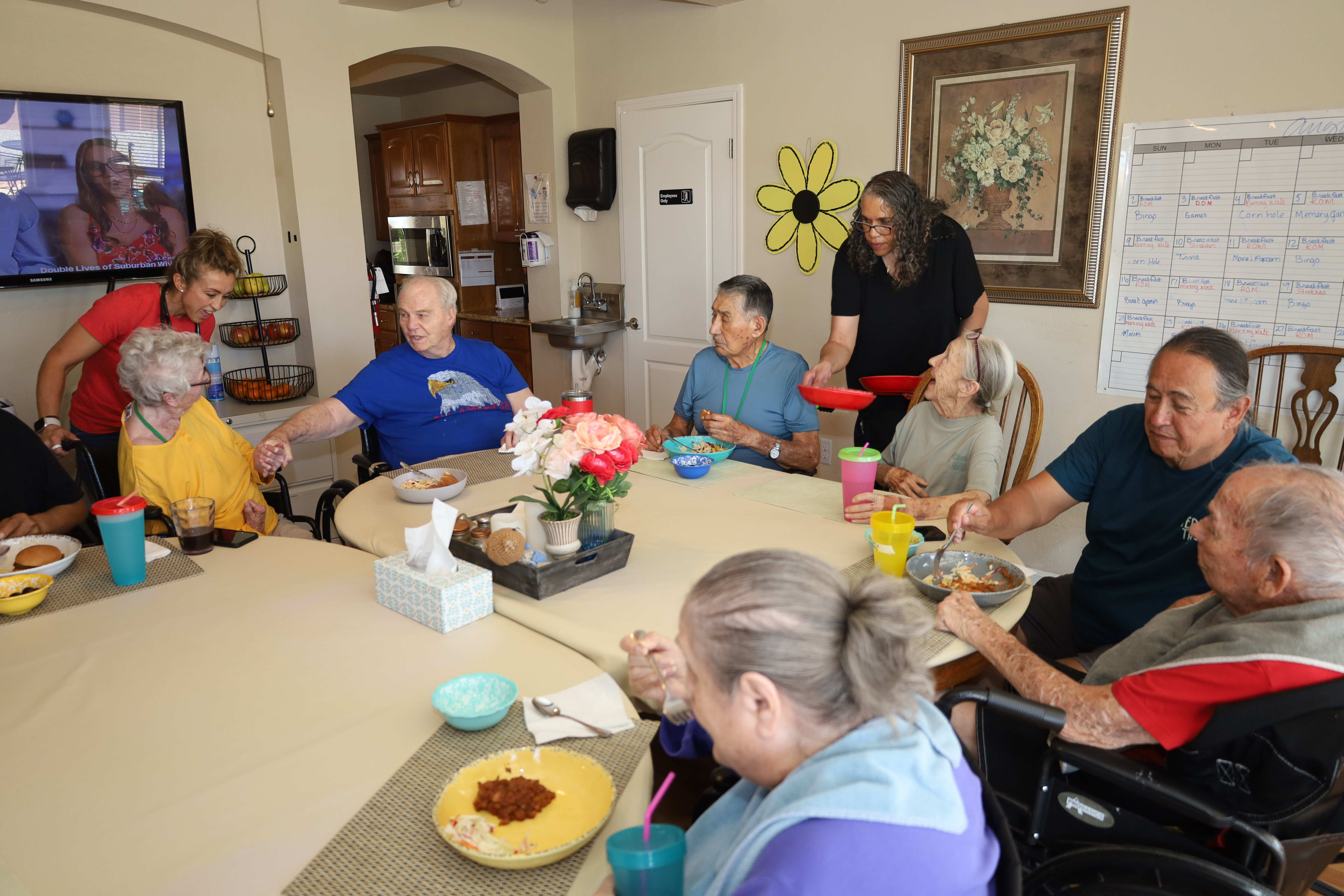 Residents and caregivers sharing an everyday moment at Casita Senior Living