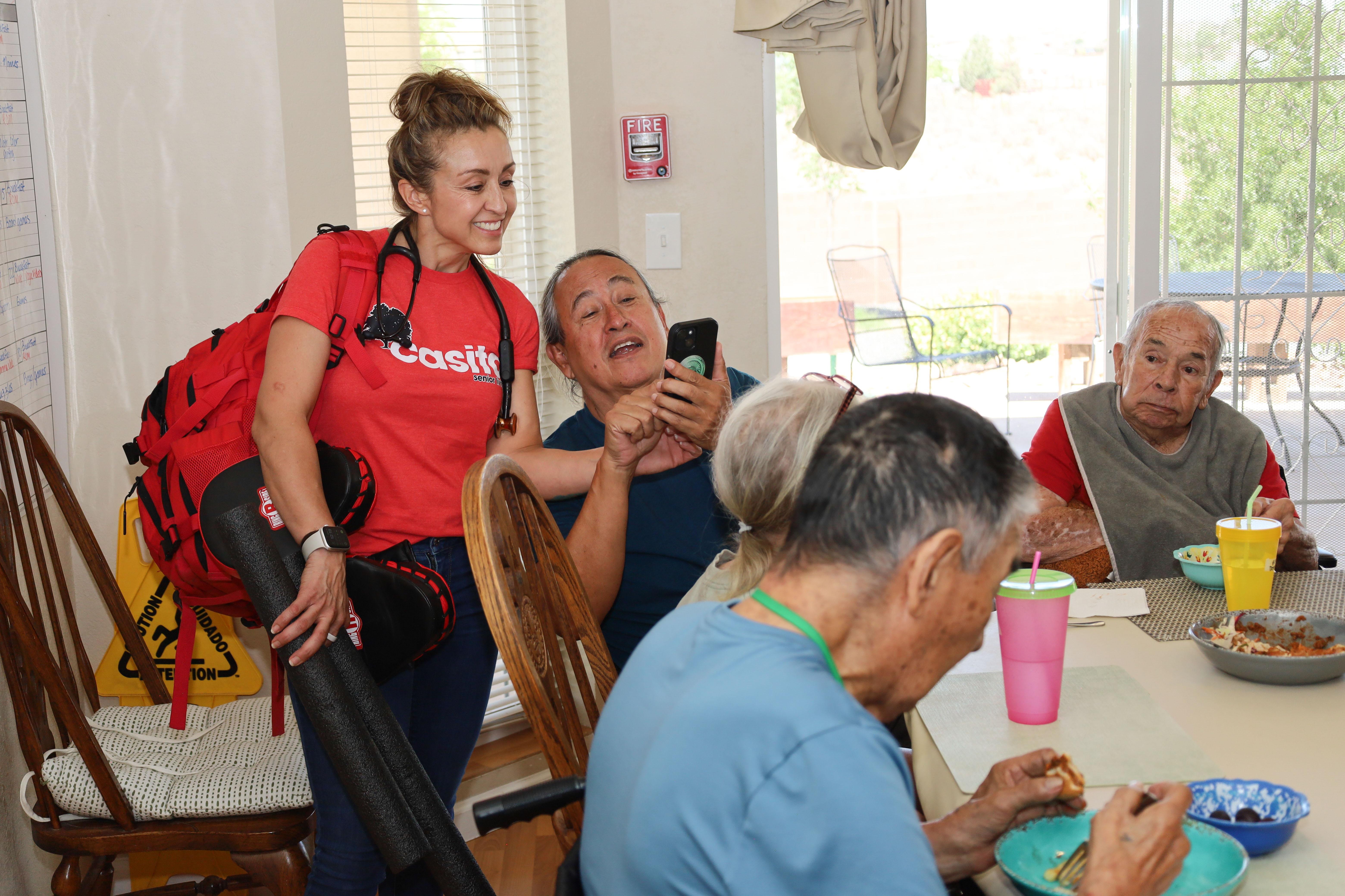 Residents and caregivers sharing an everyday moment at Casita Senior Living